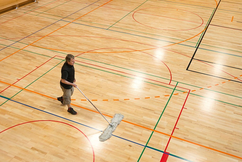 how to remove oil based chemicals from basketball rubbermat floor